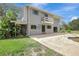 Two story home with a balcony, spacious yard, and pool at 6633 Old Ranch Rd, Sarasota, FL 34241