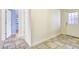 Hallway with tile floors and white trim throughout the interior space at 6633 Old Ranch Rd, Sarasota, FL 34241