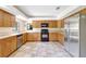 Well-equipped kitchen featuring stainless steel appliances and light wood cabinetry at 6633 Old Ranch Rd, Sarasota, FL 34241