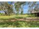 Vast open space with lush green grass and mature shady trees at 6633 Old Ranch Rd, Sarasota, FL 34241