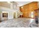 Open living room showcases a stone fireplace, staircase, and wood accents at 6633 Old Ranch Rd, Sarasota, FL 34241
