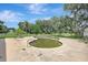 View of the in-ground swimming pool surrounded by greenery at 6633 Old Ranch Rd, Sarasota, FL 34241