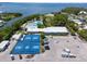 A stunning aerial view showcases outdoor recreational facilities, including courts, a pool, and parking at 6707 Northampton Pl, Bradenton, FL 34207