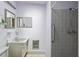 This bathroom has a shower and a sink, with lavender walls and white tile at 6707 Northampton Pl, Bradenton, FL 34207