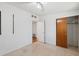 The bedroom has light colored walls, speckled tile, and a wood closet at 6707 Northampton Pl, Bradenton, FL 34207