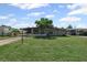 Charming single-story home featuring a well-maintained lawn and mature landscaping with a carport and inviting facade at 6707 Northampton Pl, Bradenton, FL 34207