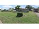Single-story home featuring a well-maintained front yard, shrubbery, and an inviting facade in a serene residential setting at 6707 Northampton Pl, Bradenton, FL 34207