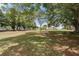 Expansive green space with mature trees, ideal for recreation and relaxation outdoors at 6707 Northampton Pl, Bradenton, FL 34207