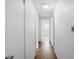 Hallway with white walls and access to other rooms at 6707 Northampton Pl, Bradenton, FL 34207
