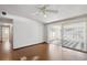 Bright living room with sliding glass doors leading to sunroom at 6707 Northampton Pl, Bradenton, FL 34207