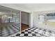 Bright sunroom offers access to the living room and outdoors at 6707 Northampton Pl, Bradenton, FL 34207