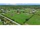 Picturesque acreage featuring a home, barn, pond and ample green space, perfect for equestrian or agricultural pursuits at 6805 225Th E St, Bradenton, FL 34211