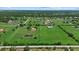 Sprawling acreage featuring a home, pond, and ample green space, perfect for equestrian or agricultural pursuits at 6805 225Th E St, Bradenton, FL 34211