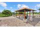 Outdoor kitchen, covered patio with a bar, and hot tub at 6805 225Th E St, Bradenton, FL 34211