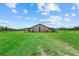 Spacious barn with ample green space is ideal for equestrian activities or livestock at 6805 225Th E St, Bradenton, FL 34211