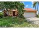 Charming one-story home with a red roof, arched windows, and a spacious two car garage at 6805 225Th E St, Bradenton, FL 34211