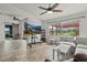 Bright living room with a vaulted ceiling, tile floors, and sliding barn door at 6805 225Th E St, Bradenton, FL 34211