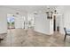 Open-concept floor plan with tile floors and light colored walls with many entry ways at 6805 225Th E St, Bradenton, FL 34211