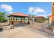 Dual covered patios with an outdoor kitchen, a bar, and paver accents at 6805 225Th E St, Bradenton, FL 34211