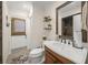 Bathroom featuring a shower, a large mirror, a single sink vanity, and access to outside at 7343 Palomino Trl, Sarasota, FL 34241