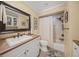 Bathroom featuring a shower-tub combo, a large mirror, and a single sink vanity at 7343 Palomino Trl, Sarasota, FL 34241