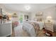 Bedroom featuring an area for sitting and decor hanging on the door that leads outside at 7343 Palomino Trl, Sarasota, FL 34241
