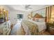Inviting bedroom with a ceiling fan, a view of the pool, and lots of natural light at 7343 Palomino Trl, Sarasota, FL 34241
