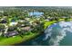 Expansive aerial view of a waterside home, highlighting its beautiful landscaping and lakefront location at 7426 Weeping Willow Blvd, Sarasota, FL 34241