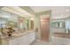 Open bathroom features granite counters, dual sinks, shower and bath at 7426 Weeping Willow Blvd, Sarasota, FL 34241