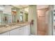 Bathroom featuring granite counters, dual sinks, shower and bath at 7426 Weeping Willow Blvd, Sarasota, FL 34241