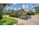 Wide view of a paved driveway with landscaping at 7426 Weeping Willow Blvd, Sarasota, FL 34241