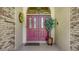 Close-up of an elegant, red double-door with glass panels at 7426 Weeping Willow Blvd, Sarasota, FL 34241