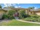 Inviting front entrance with brick accents and a red double-door at 7426 Weeping Willow Blvd, Sarasota, FL 34241