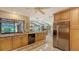 Spacious kitchen with granite counters, stainless steel appliances, tile flooring, and ample storage space for convenience at 7426 Weeping Willow Blvd, Sarasota, FL 34241