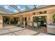 Outdoor lanai with a seating area and grill, perfect for entertaining and enjoying outdoor living at 7426 Weeping Willow Blvd, Sarasota, FL 34241