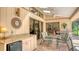 Relaxing outdoor patio with a grill, dining area, and access to other areas of the home at 7426 Weeping Willow Blvd, Sarasota, FL 34241