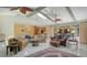Spacious living room with beamed ceilings, skylights, and an open floor plan at 7426 Weeping Willow Blvd, Sarasota, FL 34241
