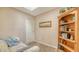 Cozy office space with a bookshelf and natural light, creating an ideal work environment at 7426 Weeping Willow Blvd, Sarasota, FL 34241