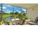 Screened balcony offers beautiful views of the golf course and surrounding nature at 7461 W Country Club N Dr # 206, Sarasota, FL 34243