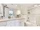 Well-maintained bathroom with modern fixtures, a shower-tub combination, and ample counter space at 7461 W Country Club N Dr # 206, Sarasota, FL 34243