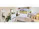 Inviting bedroom with a large window overlooking the golf course, plus lots of natural light at 7461 W Country Club N Dr # 206, Sarasota, FL 34243