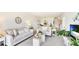Bright living room with comfortable seating and stylish decor throughout the open floor plan at 7461 W Country Club N Dr # 206, Sarasota, FL 34243