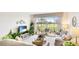 Living room boasting view of the golf course with a comfortable sofa and stylish decor at 7461 W Country Club N Dr # 206, Sarasota, FL 34243