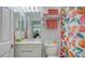 Bathroom showcasing a vanity, sink, decorative towels, and a peach-themed shower curtain and decor at 7915 115Th E Ave, Parrish, FL 34219