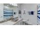 Bathroom featuring a unique vessel sink, granite countertop, and nautical-themed decor at 7915 115Th E Ave, Parrish, FL 34219