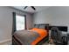 Bedroom featuring a large bed, a workspace, and ample natural light from the window at 7915 115Th E Ave, Parrish, FL 34219