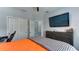 Bedroom featuring a dresser with a TV, closet space, and a ceiling fan at 7915 115Th E Ave, Parrish, FL 34219