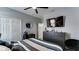 Comfortable bedroom featuring a dresser with a TV and a closet, perfect for storage at 7915 115Th E Ave, Parrish, FL 34219