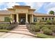 Inviting building entrance with well-kept landscaping, stone accents, and attractive architectural details at 7915 115Th E Ave, Parrish, FL 34219