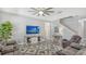 Spacious living room with plush seating, modern decor, and plenty of natural light at 7915 115Th E Ave, Parrish, FL 34219